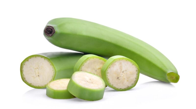 Sliced ​​green banana with peel.